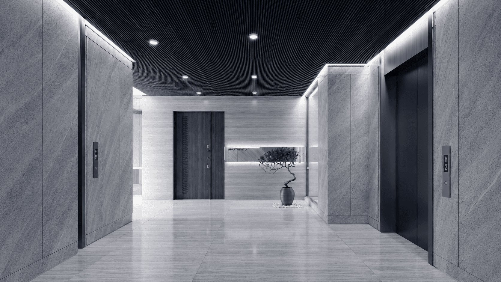 A black and white photograph of the lobby of Dominion, a Sydney residential building managed by LUNA and cleaned by ARTOO.